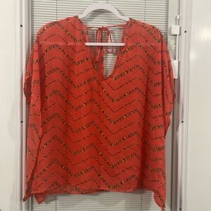 Charlotte Russe blouse, Women’s size M, coral/orange with chevron type print.